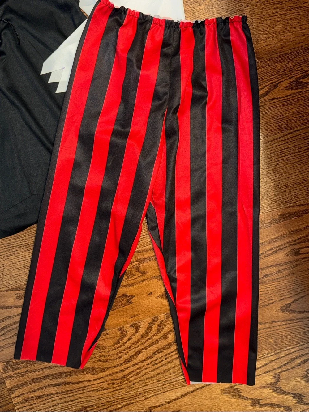 Size s/6-8 pirate costume. Shirt, Pants, Belt, Boot Covers, Scarf, wrist cuffs.